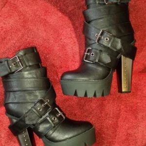 Leather boots. Zip up back.  With straps